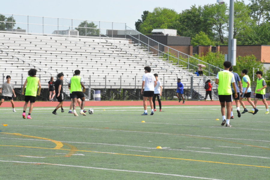 The varsity boys soccer team prepares for an upcoming game through tactical work at practice after school on May 10. (Haley Oeur)