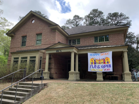 At the College of William & Mary’s Day for Admitted Students, fraternity house Phi Gamma Delta puts up a sign welcoming the potential incoming freshmen of the William & Mary class of 2027.