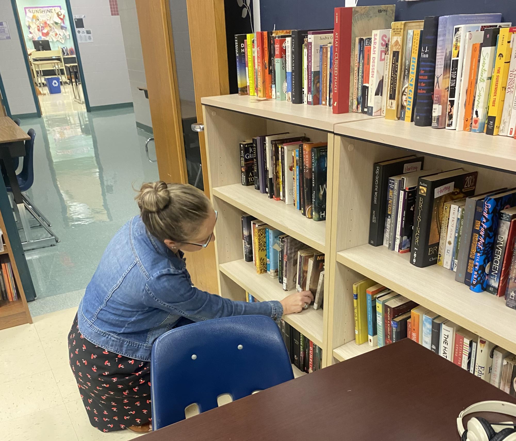 English Teacher Sarah Hartley picks out some books to read. 