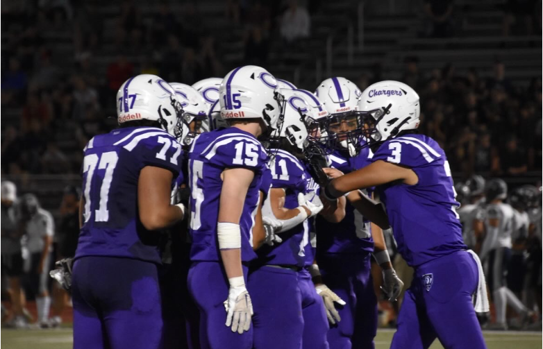 The+Chantilly+High+School+team+huddles+together+during+their+home+game+against+Woodson+High+School+on+August+31.+Chantilly+won+31-21.%0A%0A