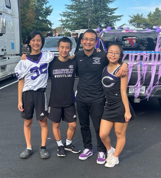 Assistant principal Jihoon Shin and his three children, freshman Tyler  Shin, sophomore Carter Shin and sophomore Reagan Shin participate in the homecoming activities on Oct. 6.

