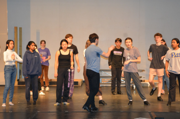 Sam Wolff and his tap group practice the choreography during rehearsals. 