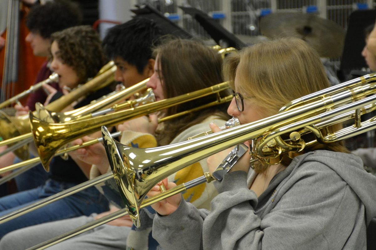 Seniors Natalie Shinego, Kyle Cobb, Alex Marcalaya and Sasha Smith play their trombones on March 15. Photo by Tyler Ellison.