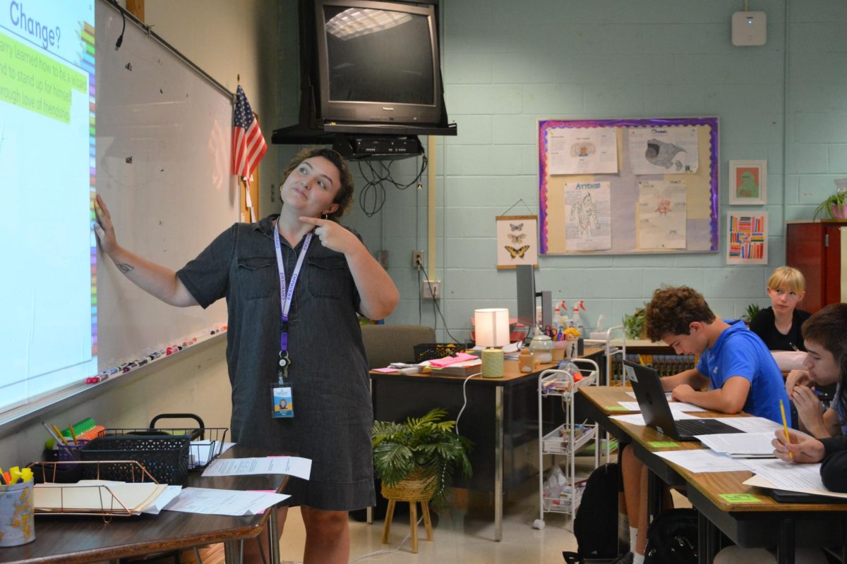 English teacher Michelle Vega engages with her students in a discussion about today’s lesson on themes.