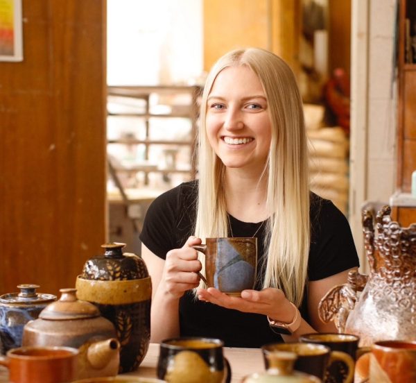 Art teacher Danielle Kennedy shows the pottery that she made.

Photo courtesy of Danielle Kennedy