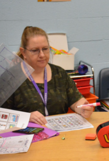 Special Education teacher Liz Dodd plays bingo with her students.