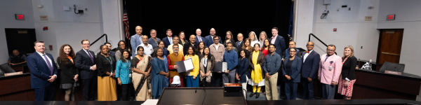 The School Board takes a photo with meeting attendees to celebrate the recognition of Hindu American Heritage Month. Photo courtesy of the Fairfax County School Board