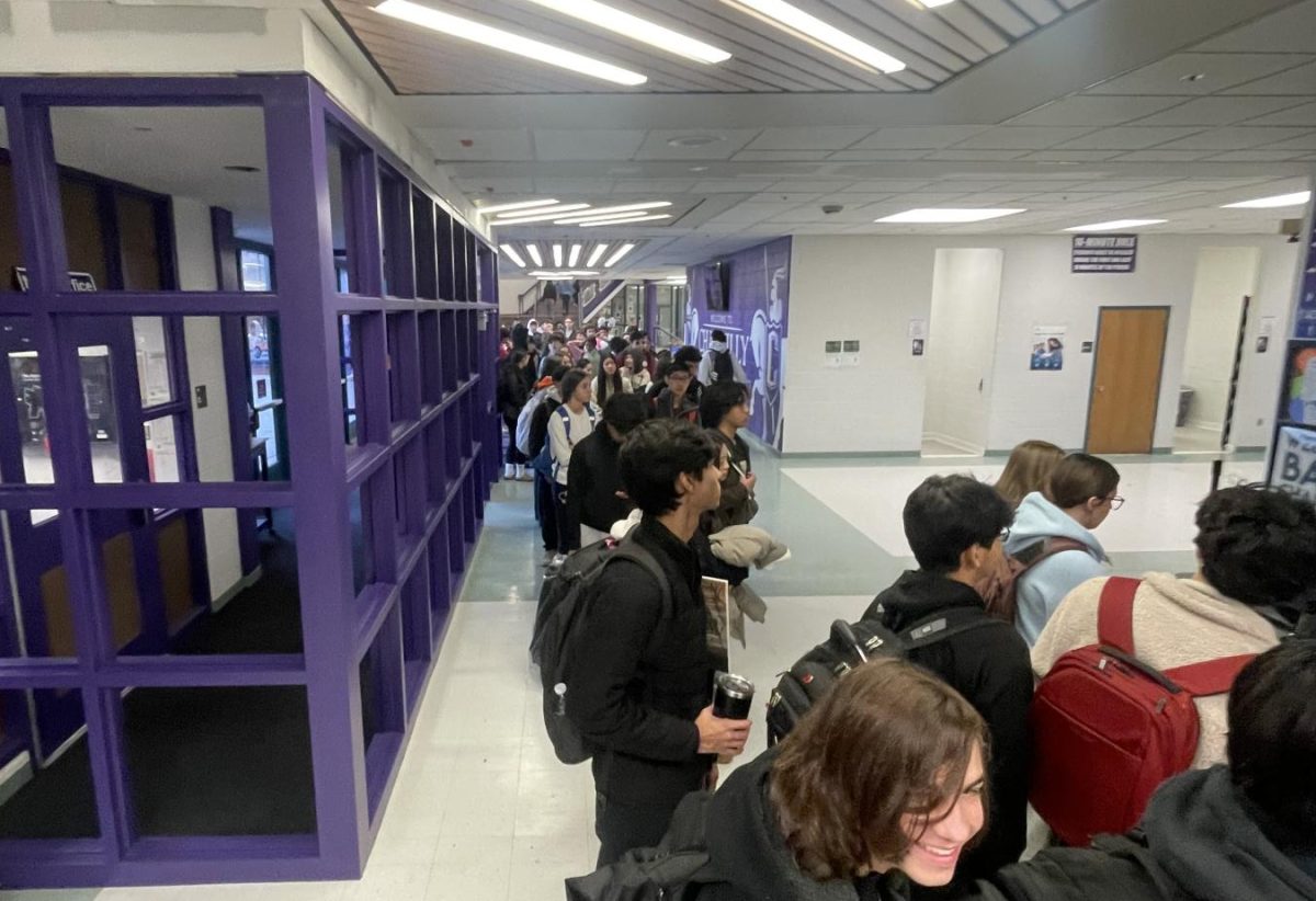 Over 100 students wait to check in at the tardy table the morning of Dec. 18. Photo by Ryan Galione