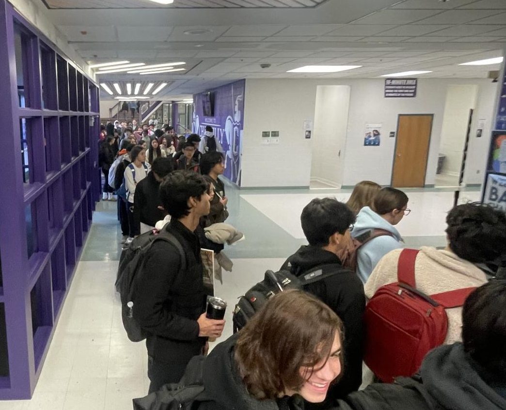 Over 100 students wait to check in at the tardy table the morning of Dec. 18. Photo by Ryan Galione