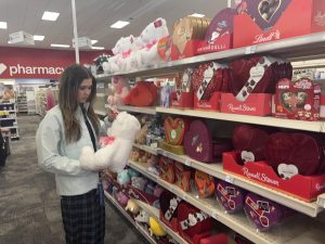 Senior Caroline Donovan looks through various Valentine’s Day items, searching for the perfect gift for her Valentine this year.