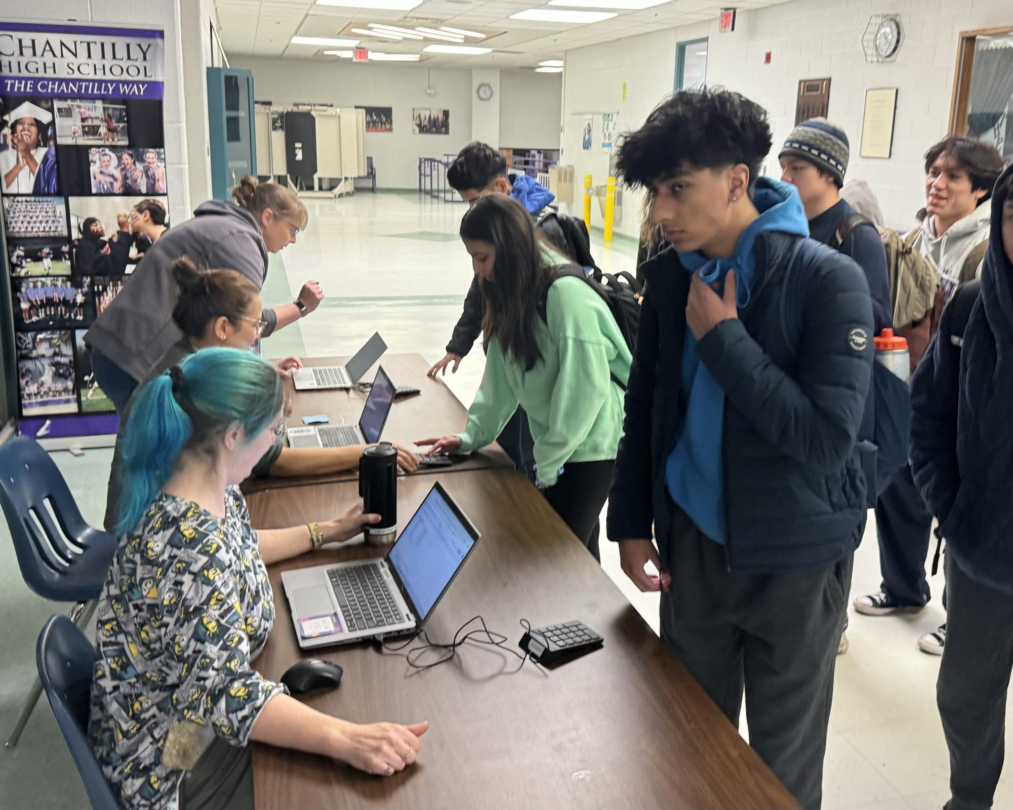 Students arriving after 8:10 enter their student IDs to check in on Feb. 6. Photo by Nischal Annapareddy