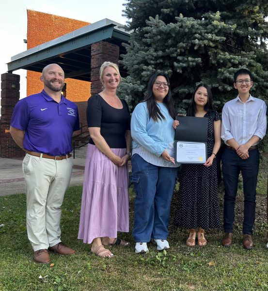 Assistant principal Zack Winfrey, principal Dr. Amy Goodloe, sophomore online managing editor Alexine Cornelio, junior editor-in-chief Lizzie Sun and yearbook adviser Luc Nguyen accept the school board’s recognition of CHS’s receipt of the First Amendment Press Freedom Award on June 27, 2024. Photo courtesy of Abby Cornelio