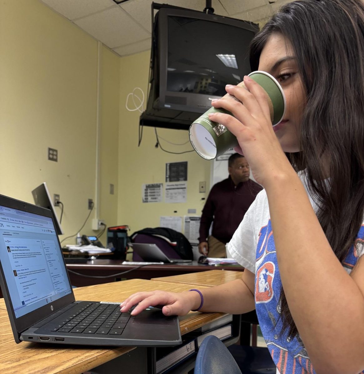 During first period on Feb. 18, junior Sopris Kilker drinks coffee to boost her focus in social studies teacher Victor Scott’s class.