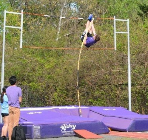 Senior Trent Saben practices pole vaulting with coach James Steck watching on April 21.