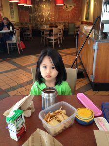 On Jan. 14, 2014, 6-year-old Lizzie Sun eats her leftover lunch at Einstein Bros. By then, English had replaced her first language, Korean. 
