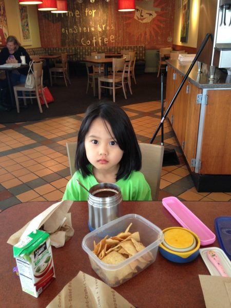 On Jan. 14, 2014, 6-year-old Lizzie Sun eats her leftover lunch at Einstein Bros. By then, English had replaced her first language, Korean. 
