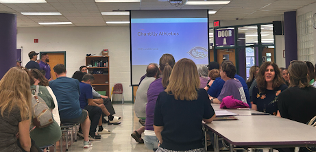 Parents and students wait for the Future of CHS Athletics meeting to start in the cafeteria on May 7.