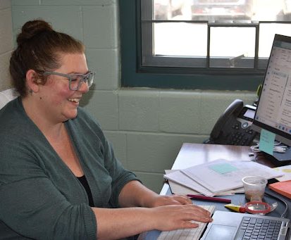 Comprehensive Service Site (CSS) Department Chair Amanda Spangrud responds to an email during her lunch break. 
