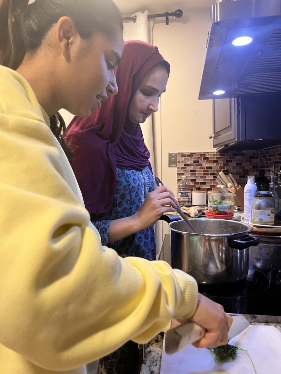 On Nov 19, junior Huda Noorzai helped chop up cilantro to garnish on top of lubia, an Afghan kidney bean stew, which also is similar to a north Indian dish called rajma.
