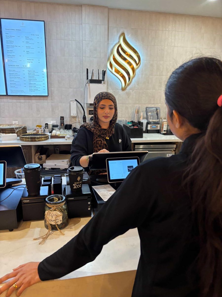 Senior Qaniya Tarat takes a customer's order on Dec. 11.