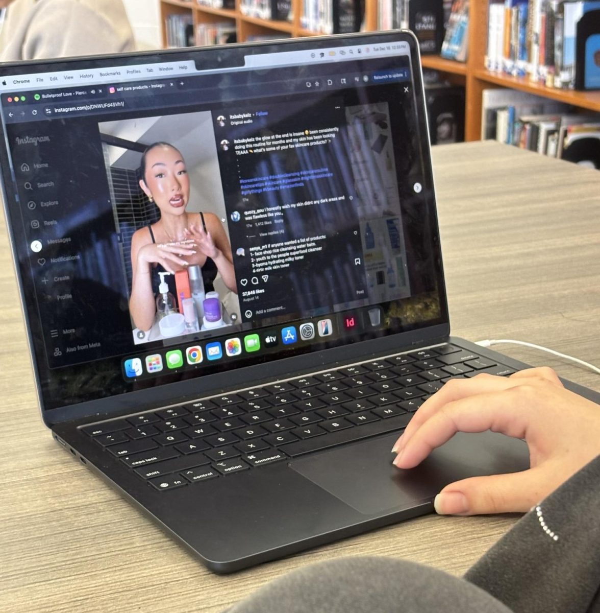 A student scrolls through influencer self-care content, where “wellness” is sold through endless products and promoted as real well-being on Dec. 16.
