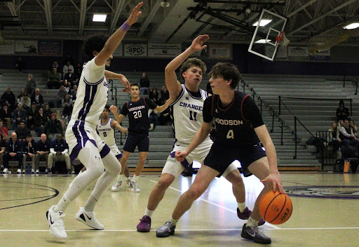 Junior Mateo Alvarado-Gallego defends a Woodson player during CHS game on Dec. 2. The Chargers used the early-season matchup to focus on communication, conditioning and teamwork as they prepare for district play. CHS lost 57-51.