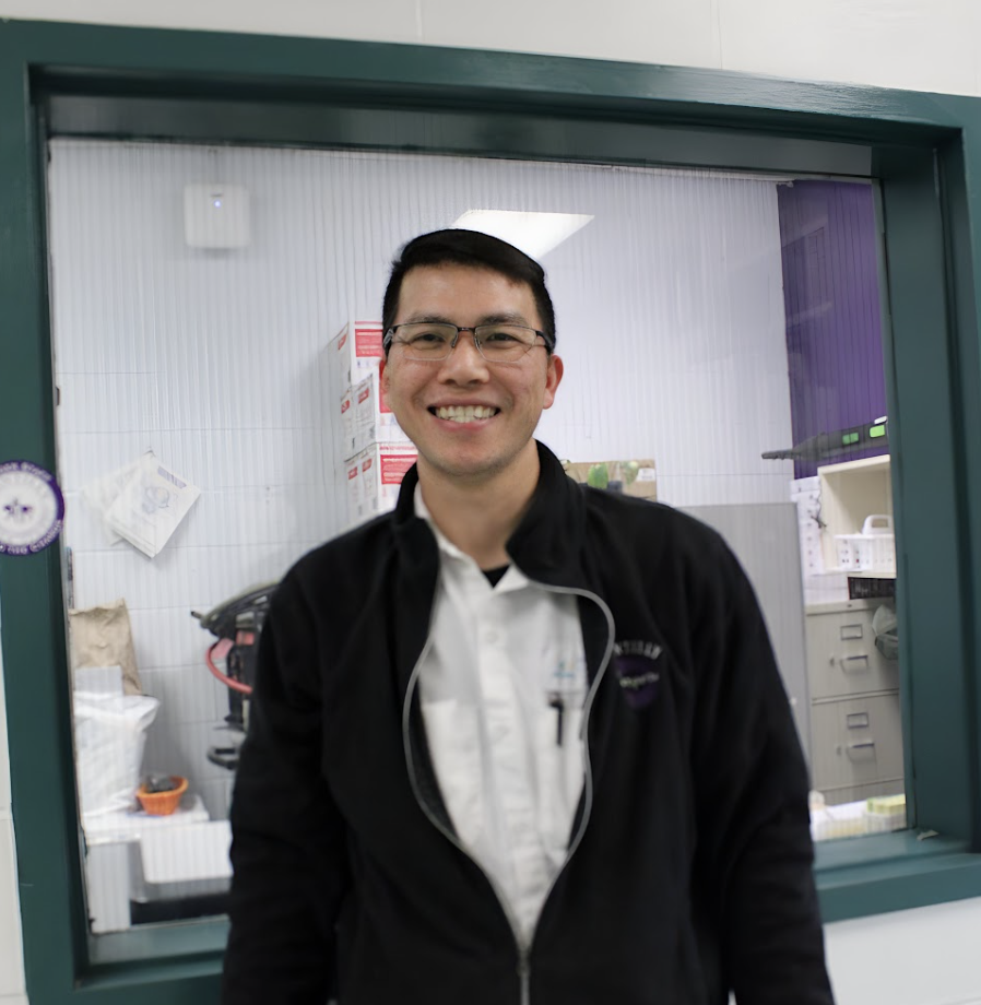 Head Custodian and Building Supervisor Tuan Vo smiles in front of his office window on Jan. 22. He joined CHS on April 1. 
