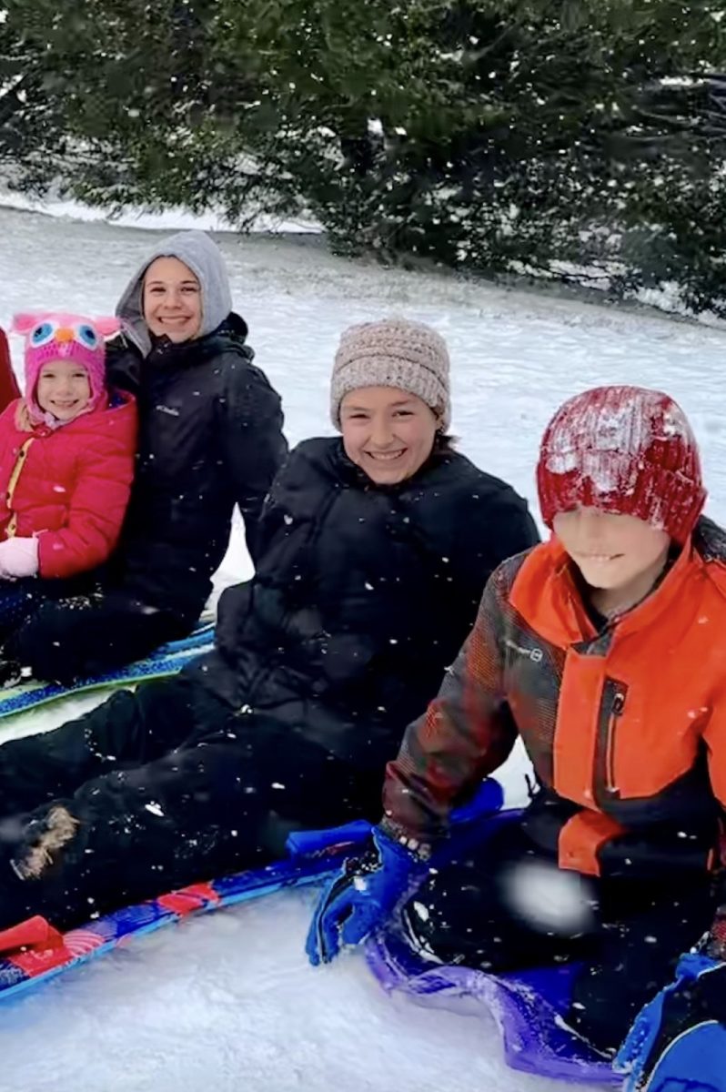 Senior Bailey Carroll prepares to sled with family and friends on Feb. 11, 2025. Photo used with permission of Bailey Carroll. 
