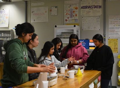 Students in the pharmacy technician double block class prepare and mix ingredients to create lotion during a hands-on compounding Feb.12. 

