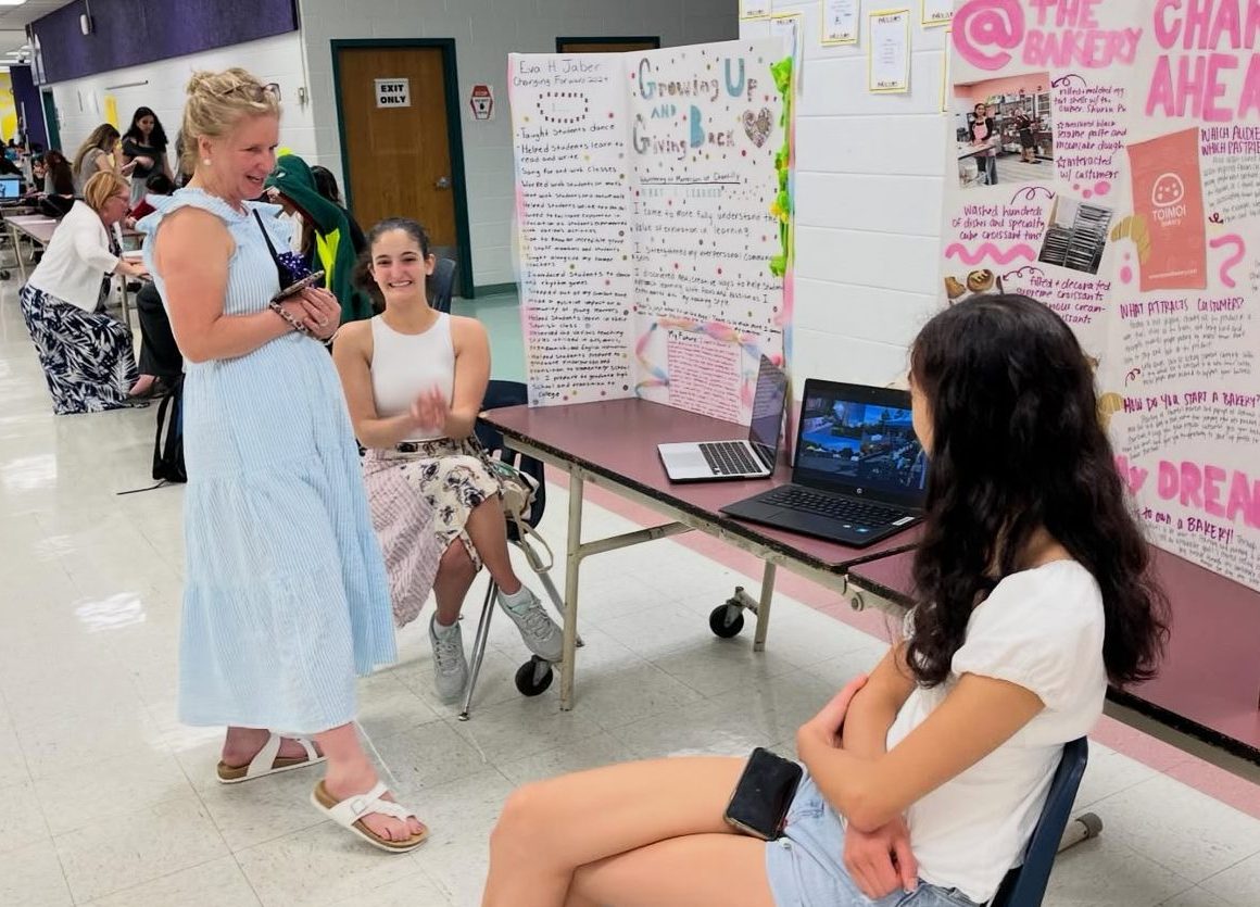 Former seniors Eva Jaber and Remi Ladia explain their projects at CHS’ first Share Fair in 2024. Photo used with permission of Jihoon Shin