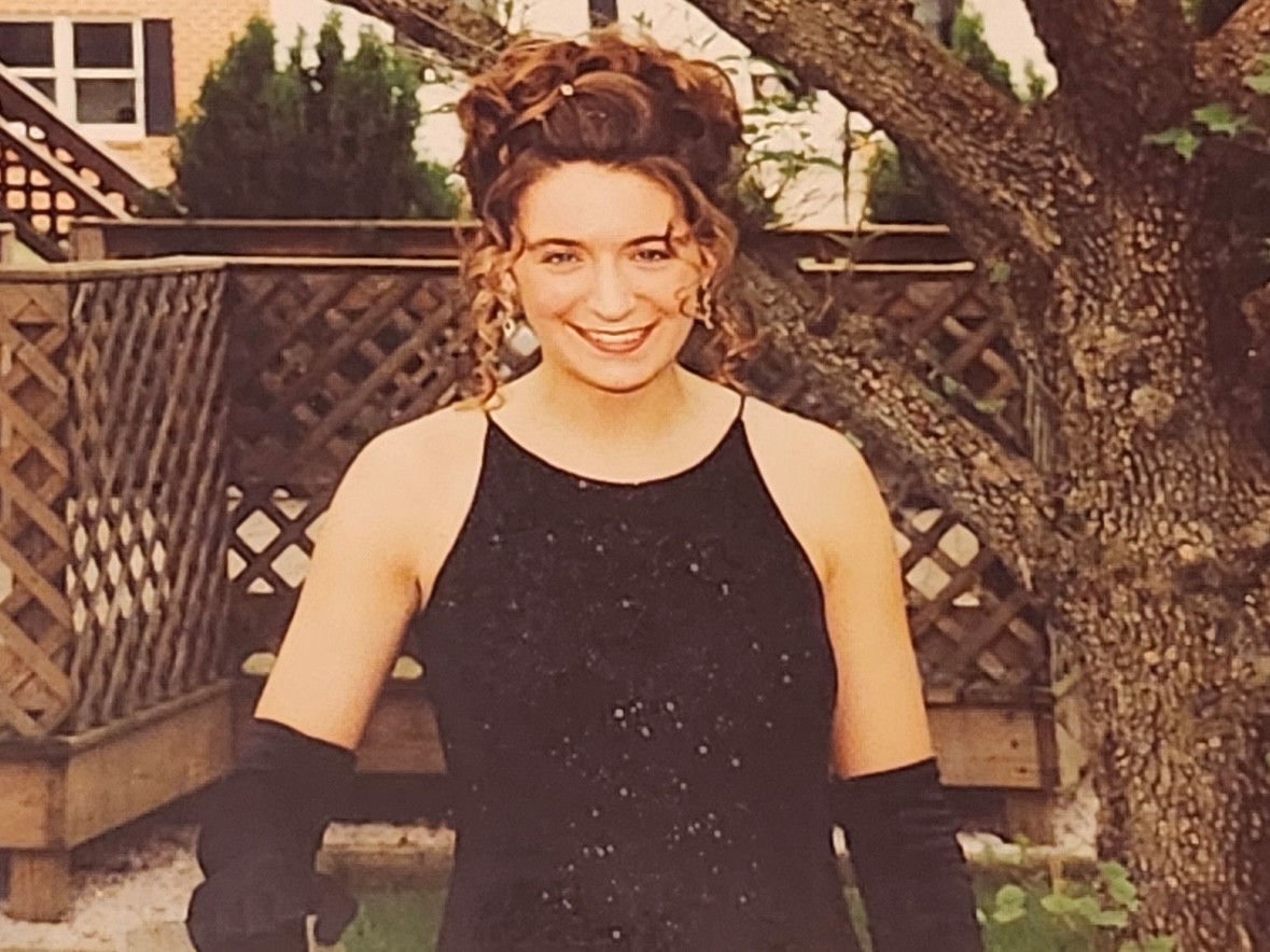 English teacher Nicole Lehman takes a photo before attending prom in 1995 wearing a sequence black dress and long gloves. Photo used with the permission of Nicole Lehman. 