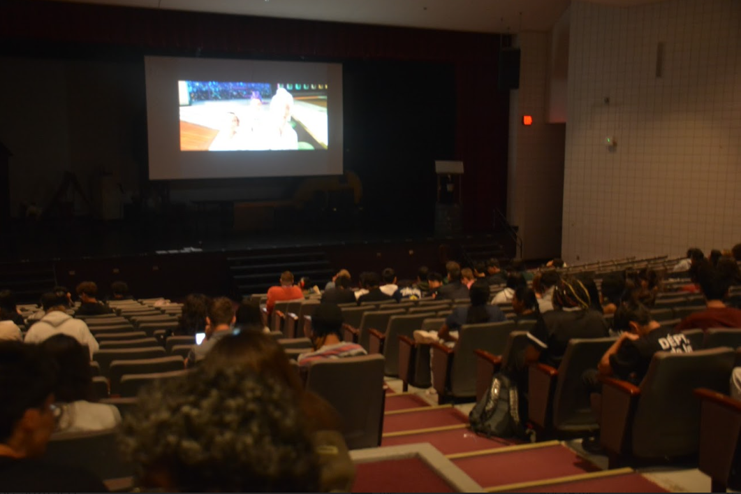 “KPop Demon Hunters” plays in the auditorium.