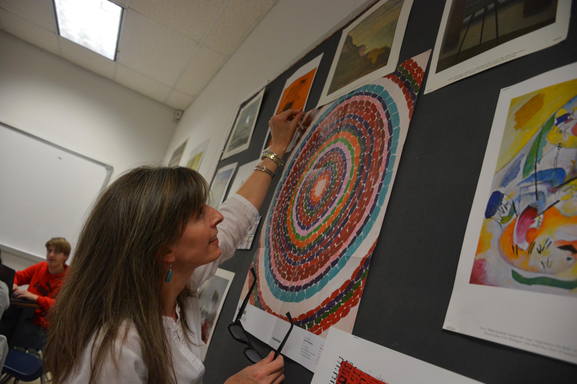English teacher Jennifer Dean displays her favorite art pieces in her room on April 24. 
