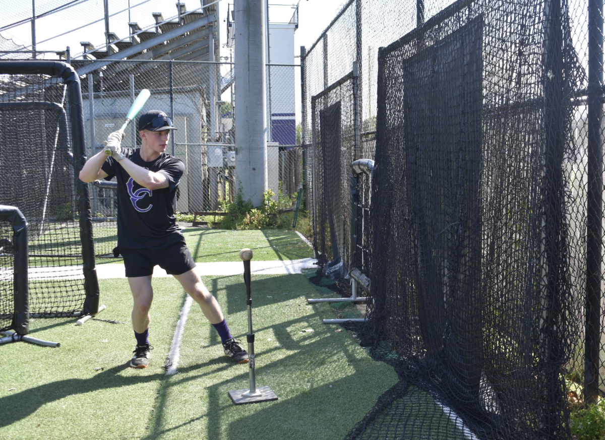 Senior Nick Zingerelli rotates his shoulders to swing a bat on May 4 during practice. 